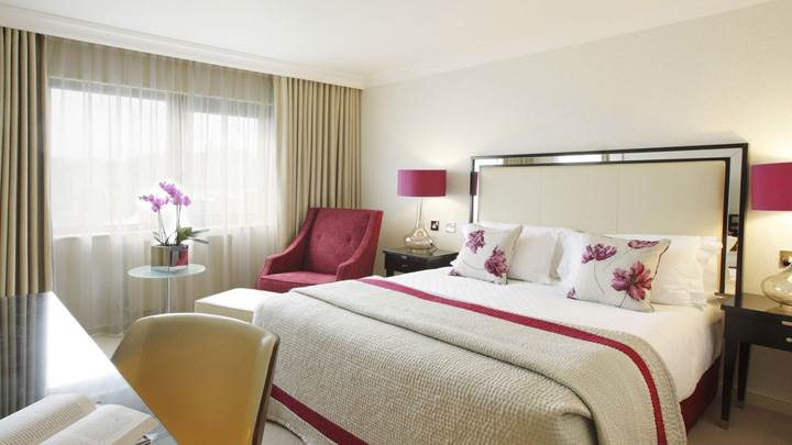 White Interior And White Bed In Room
